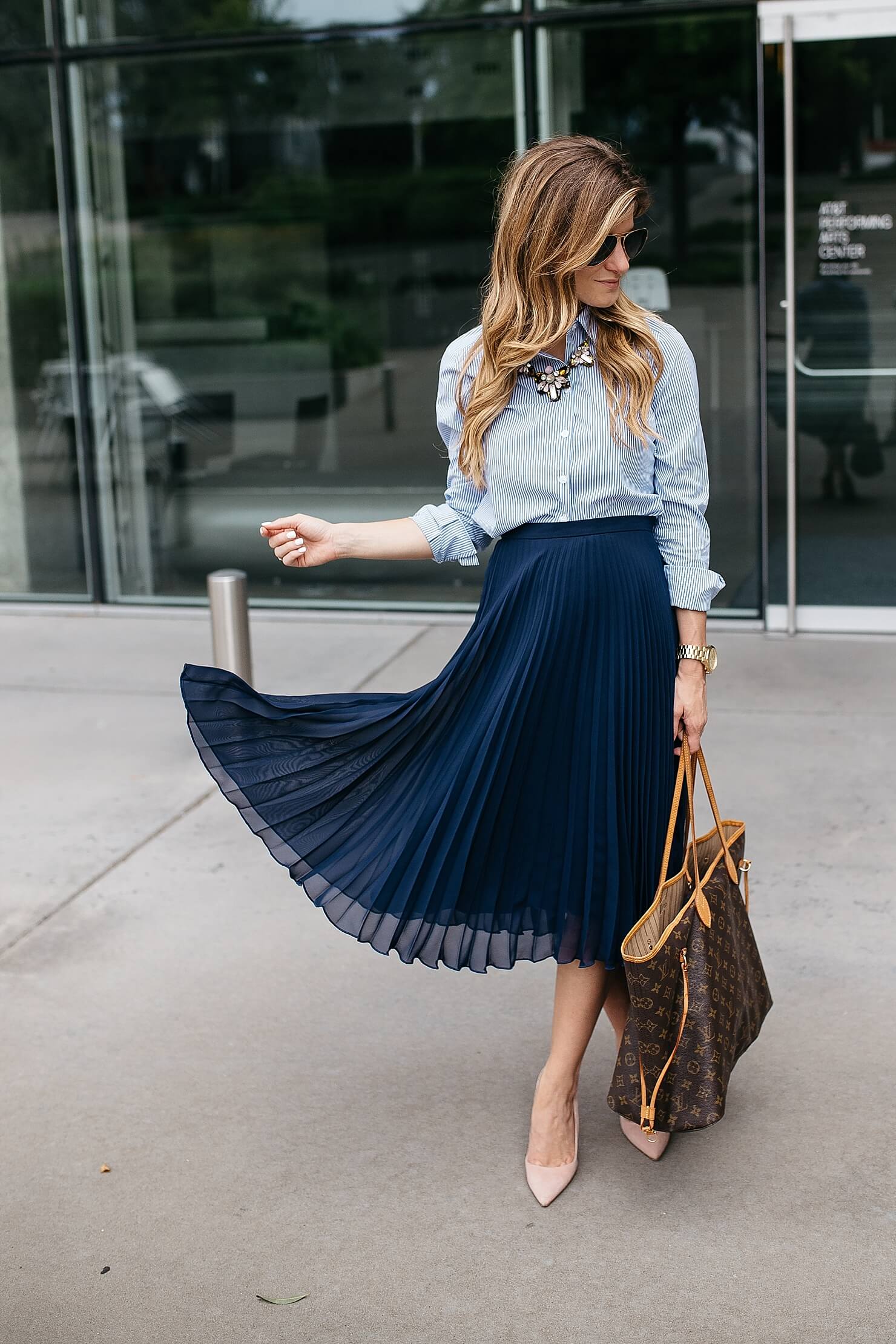 fashion woman look with pleated midi skirt