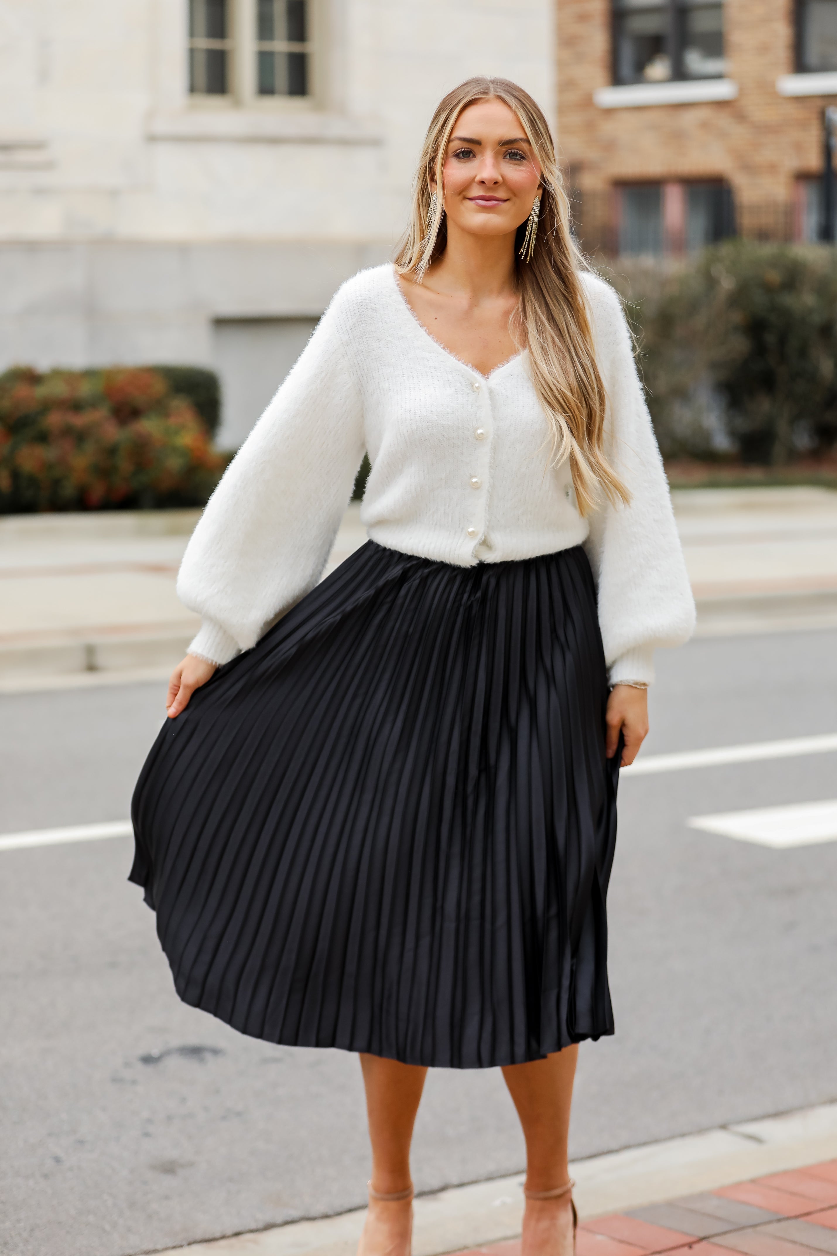 fashion woman look with pleated midi skirt